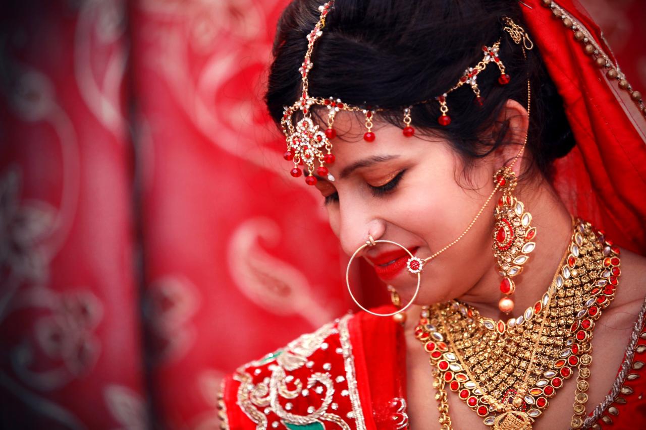 Portrait of young gorgeous Indian bride in traditional style.